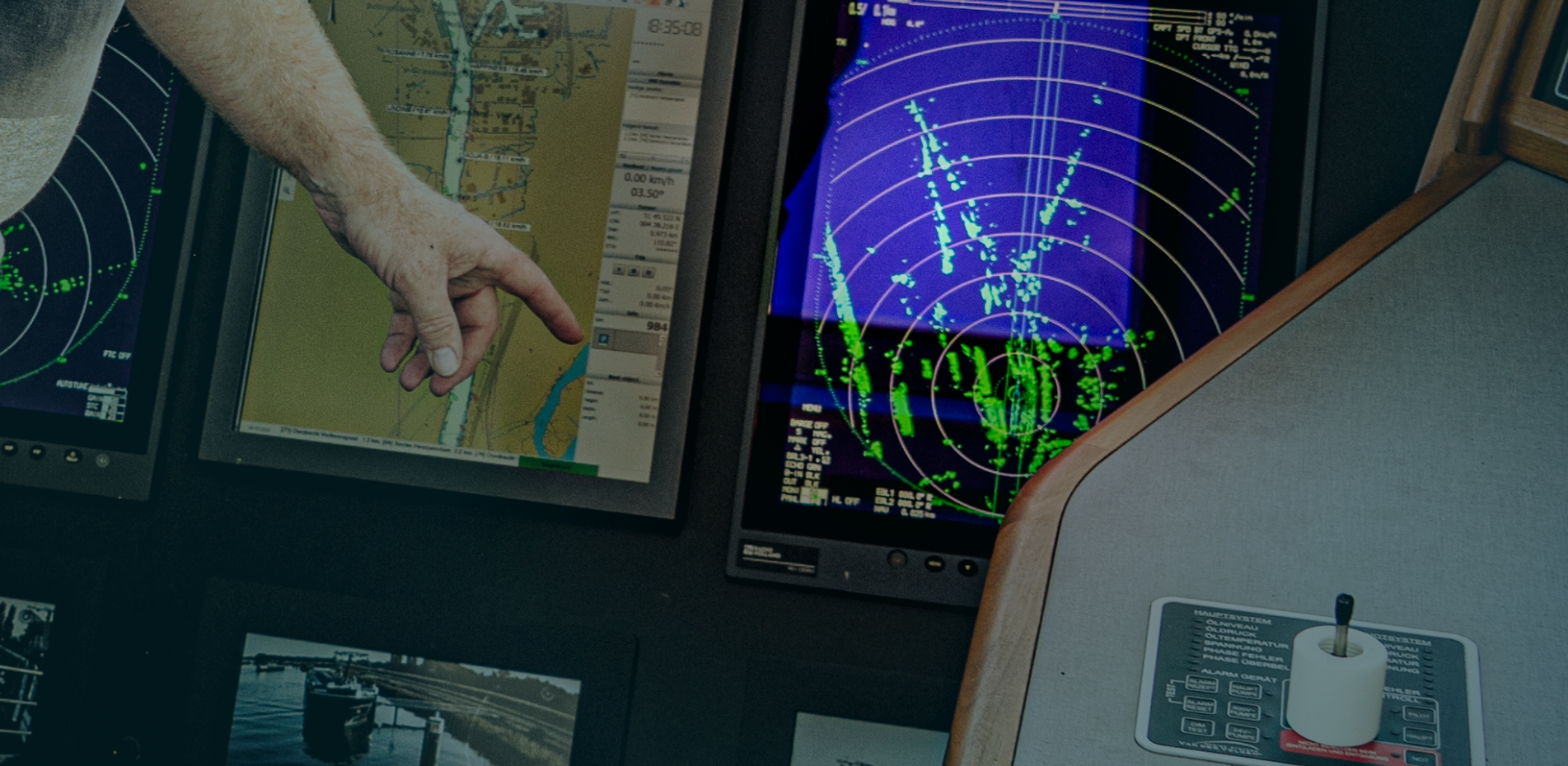 Captain points to a monitor in the command bridge